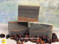 
Three stacked  Cedarwood soap bars with a natural, earthy color pattern, surrounded by dried fruits on a textured surface with Sunlit Soaps branding.