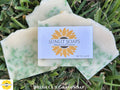 Sunlit Soaps Fresh Cut Grass soap bar on grass