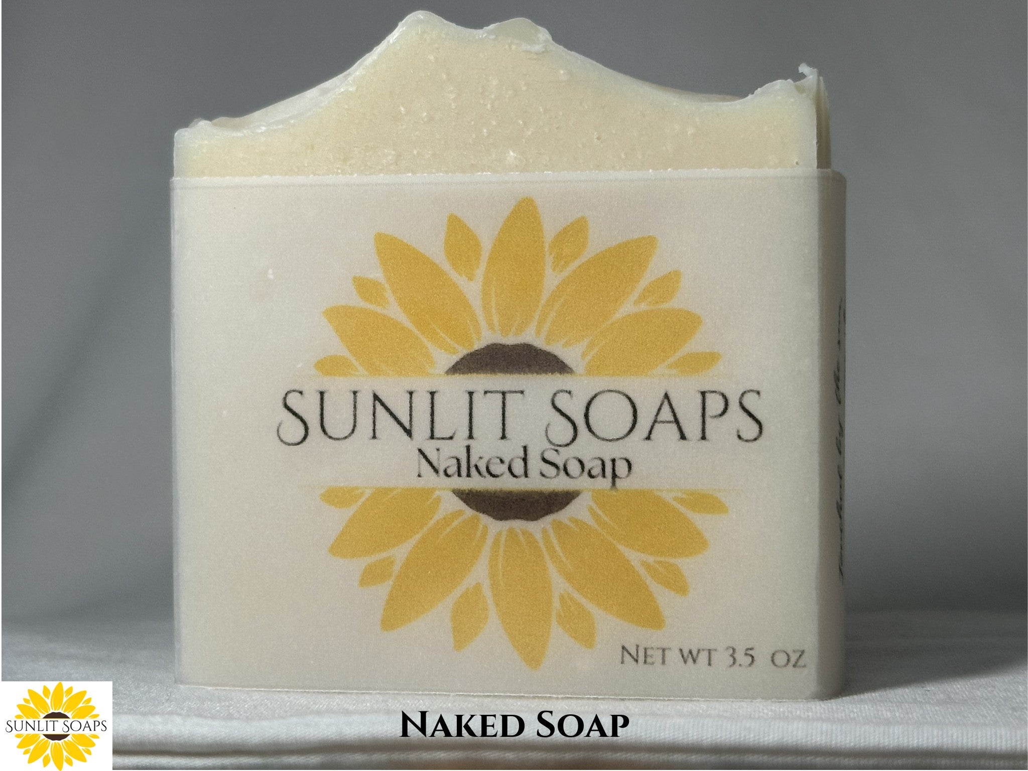 Bar of Naked Soap from Sunlit Soaps with a sunflower design on a gray background.